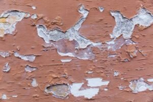 Roof leakage sign: Peeling Paint and Bubbling Walls